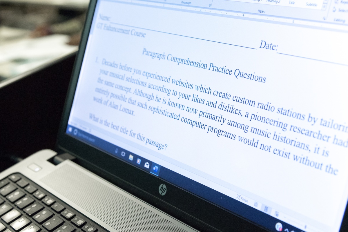 Connecticut Army National Guard soldiers participate in an ASVAB improvement class, studying at desks