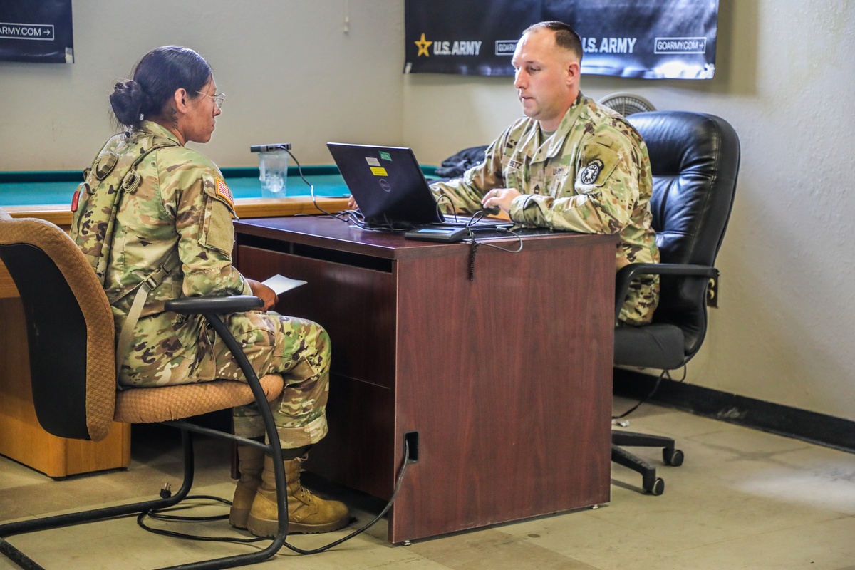 Army recruits at a Military Entrance Processing Station preparing for enlistment testing